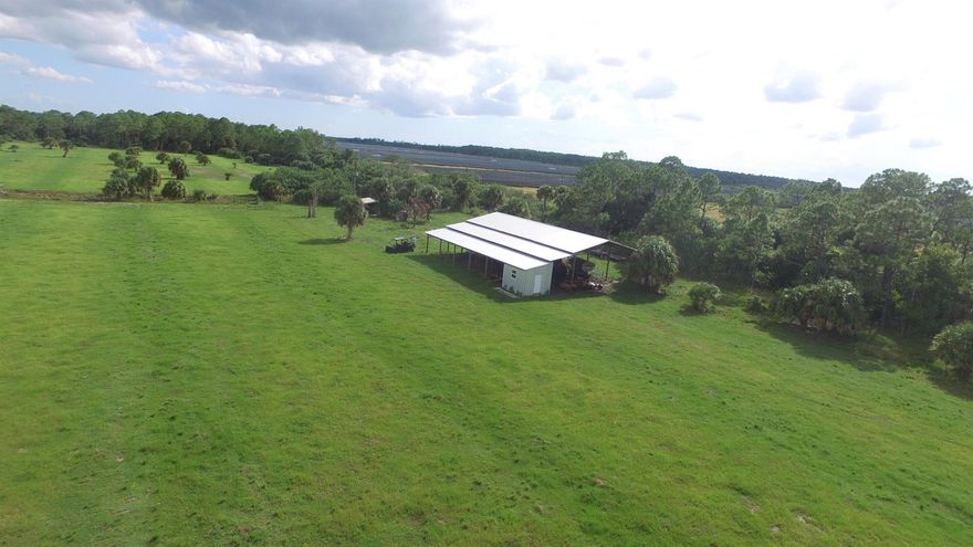 BEAUTIFUL, PEACEFUL, SERENE! 189 ACRES OF IMPROVED PASTURES PLANTED WITH TIFQUICK & TIFTON 9 BAHIA GRASSES. 5 FENCED GRAZING PASTURES EACH WITH CONCRETE WATER TROUGHS FED FROM THE ARTESIAN WELL. CATTLE LANE THE FULL LENGTH OF THE PASTURES. COZY CAMP HOUSE WITH KITCHEN AND BATHROOM BUILT IN 2020 WITH RO SYSTEM INSTALLED IN 2023. HUGE POLE BARN TO STORE ALL YOU EQUIPMENT! RV HOOK UP! NATURE AT ITS BEST!  54+ ACRES OF WOODLANDS BRINGS PLENTY OF WILDLIFE! PEACE AND SERENITY AT ITS BEST! 2 Parcels sold together