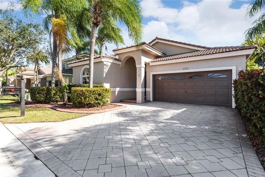 MUST SEE! EXQUISITE! SHOWS LIKE A MODEL! 3BR 2 BA/2 CAR GARAGE in GATED LENNOX ISLES. UPDATED NEWER kitchen and baths. Elongated large porcelain tiles, OPEN DESIGN showcases white kitchen cabinets, SS Appls. & gleaming granite counters & combines family & dining room overlooking screened patio. Split BR's. inside laundry w/ washer/dryer. Quality laminate floors in BR'S. Elegant Master suite features walk-in closet, updated bath w/ jetted tub, separate vanities rimless shower drs. separate water closet. Recent interior paint.Private landscaped rear yard.  ACCORDIAN SHUTTERS.. Community offers POOL, TENNIS, TOT LOT, EXERCISE & CABANA, BASKETBALL, WALKING PATHS. SERENE LAKE VIEWS~