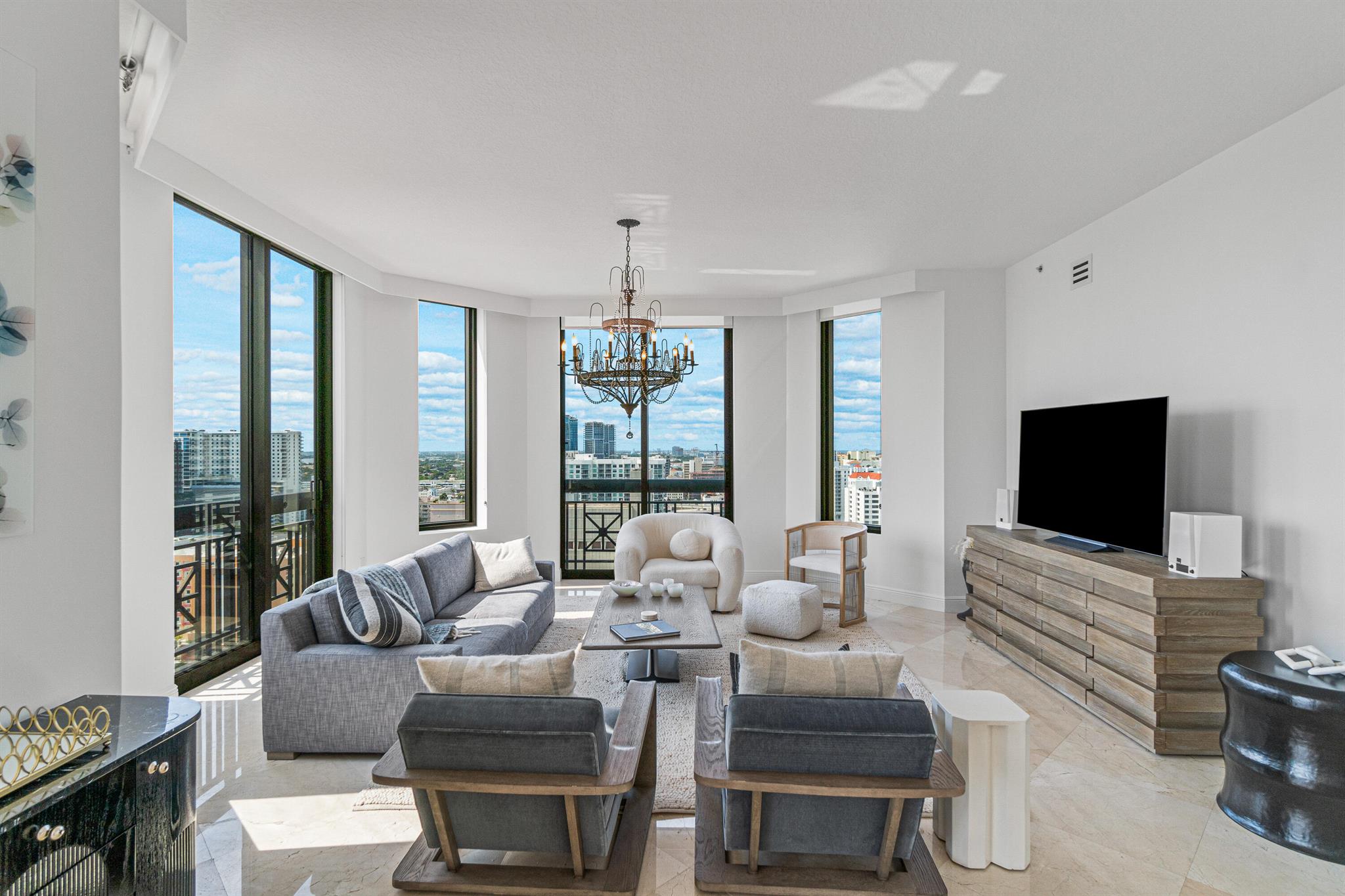 This spectacular penthouse residence is truly a magnificent home in the sky; with breathtaking panoramic city skyline sunset views and north corner ocean and intracoastal views. Highlighted by 12' ceilings, all marble flooring throughout main living and floor to ceiling glass and sliders that wrap around corner of the residence. Boasting 2,624sqft, this one-of-a-kind residence welcomes you with a light and airy spacious feel. This 3-bedroom, 3.5 bathroom plus den corner penthouse has had new carpeting in bedrooms and new furniture throughout in a modern clean feel. An expanded balcony with Clear Lake and city skyline sunset views. The Penthouse residence also offers a flex space that can be a den/office with motorized hidden murphy bed and an oversized laundry room with sink. The kitchen.