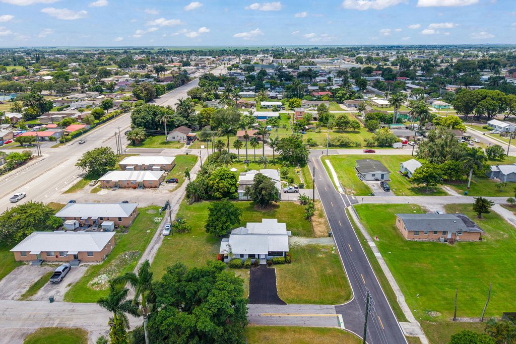 Photo of 24 NW Avenue I, Belle Glade, FL 33430 (MLS # B26043707)