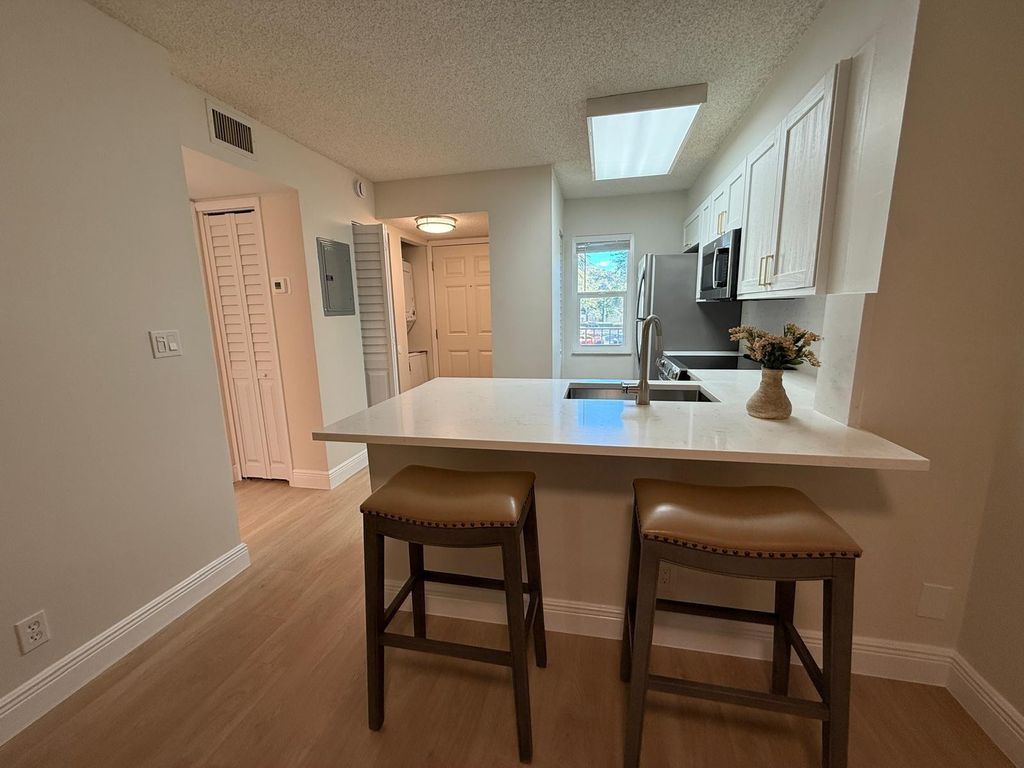 Photo of 2106 S Cypress Bend Drive #210, Pompano Beach, FL 33069 (MLS # F10551433)