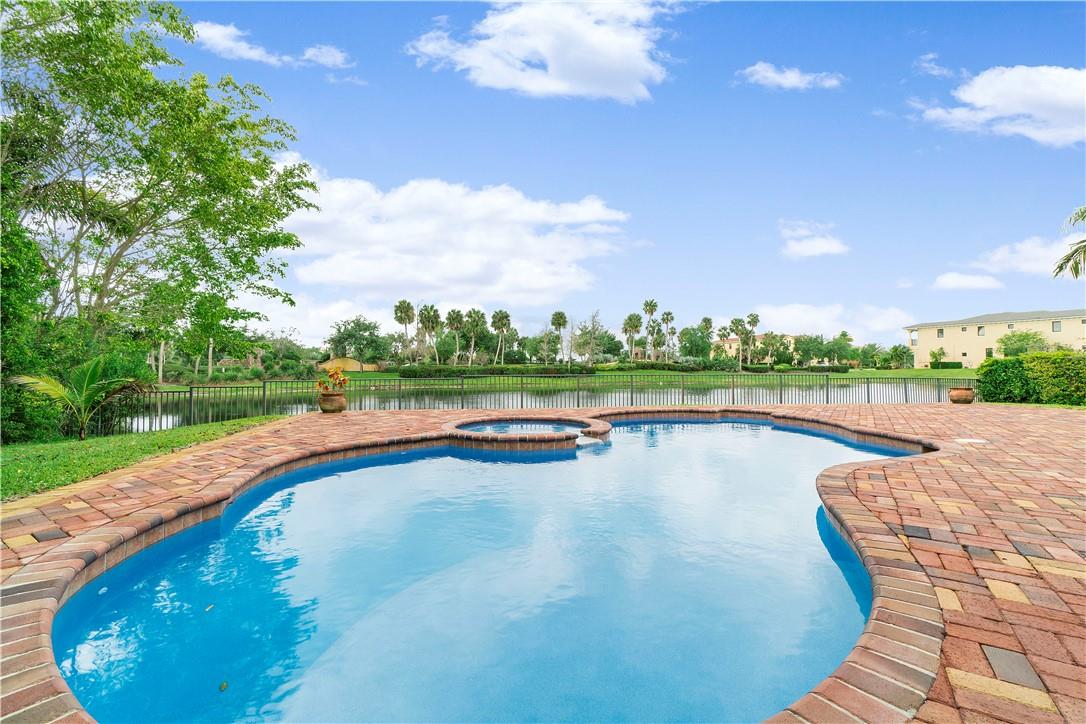 BEAUTIFUL UPDATED WATERFRONT HOME. HEATED POOL/SPA. Parkland Golf & Country Club. 4 Bds PLUS Large Office; 3 Baths; 3000+ Sq'. All Hurricane Impact. Owner pays yard, pool, tenant social membership. Fresh white interior paint. NEW ACs, washer/dryer, cooktop/ microwave/dishwasher. Marble/Wood Flrs. Triple split, high ceilings/crown molding. Large primary suite w large spa bath/2 big walk-in closets. Formal dining/living. Kitchen open to family rm-views to pool/water. Blinds; central vac; walk-in closets. Kitchen: KitchenAid fridge-water/ice dispenser; double ovens; pantry; granite counters. Center island w seating. Garage efficient storage system. Big patio. Fenced backyard facing preserve. Full access social membership/events. Club has restaurants & bar, fitness, spa, pools, monthly events.