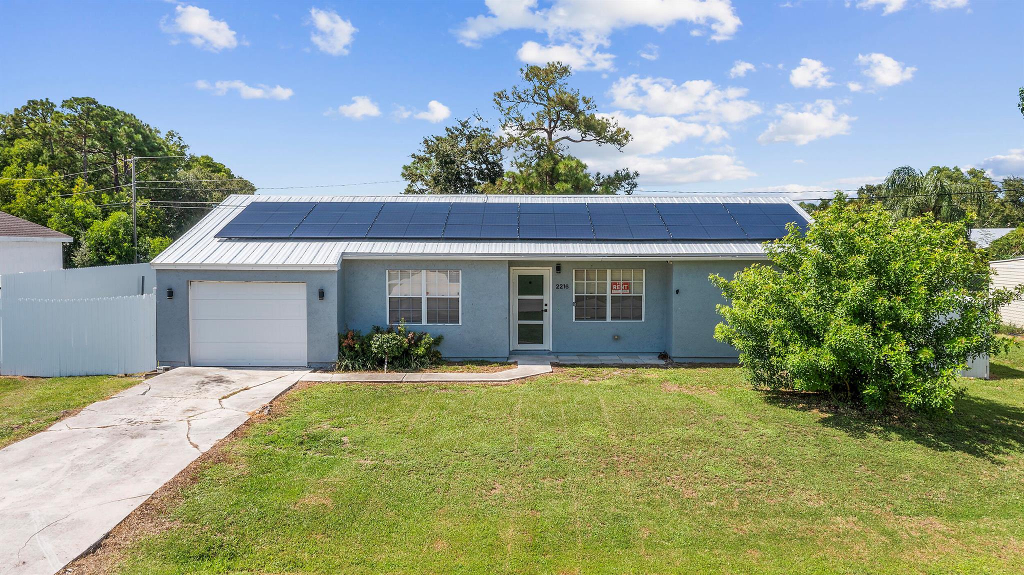 Lease this updated 3 bed, 2 bath home, with Bonus Room featuring new flooring, remodeled kitchen & baths with stainless appliances, hurricane impact doors, Fully privacy fenced yard with a storage shed. Washer & dryer included. Rent covers electricity and water for added value. Conveniently located east of US-1, close to shopping, dining, beaches, and all Port St. Lucie has to offer. No HOA! Pets welcome! Professional photos coming soon. Rent Spree App: https://apply.link/PUll388