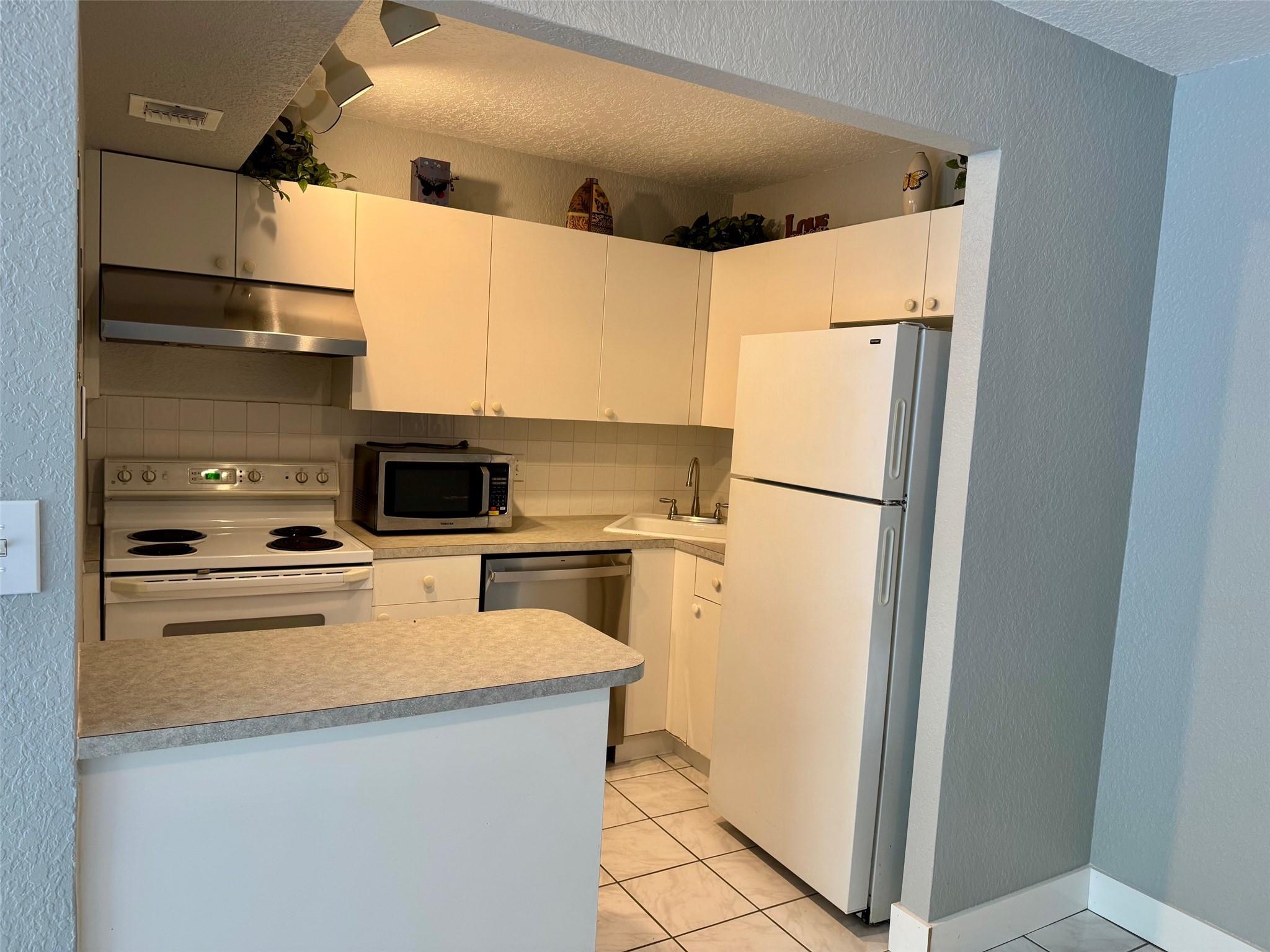 What a great 1 bedroom 1 1/2 bathroom condo for rent in Entrada on the first floor. This awesome unit is spacious with all tile flooring, living and dining area and a walk in closet. New dishwasher, water heater and stove hood. New toilets and faucets. All textured walls and ceiling and only a 4 year old ac. Park in front of your unit. Screened patio. The association requires a 690 credit score or better. Close to shopping, restaurants, highways and so much more.