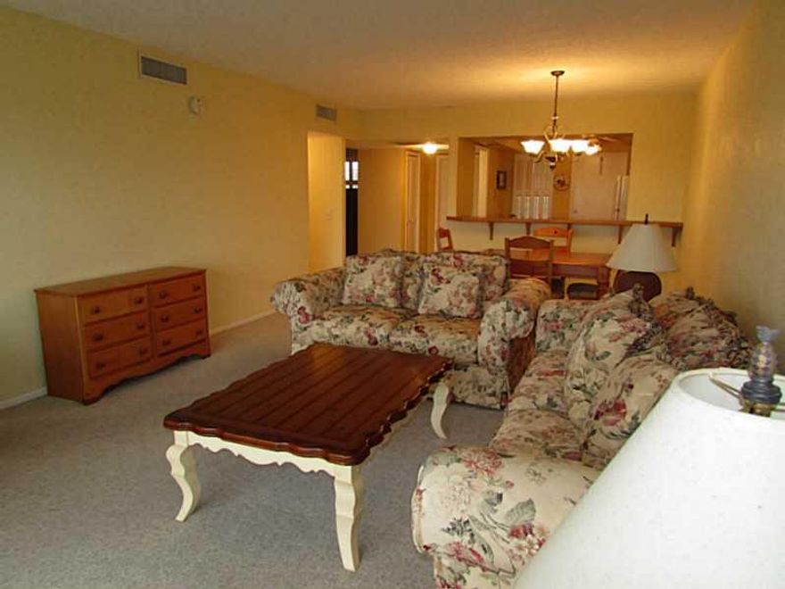 BEAUTIFUL SUNNY 2BDRM/2BA CONDO OVERLOOKING LUSH GOLF COURSE W/  DESIRABLE SOUTHERN EXPOSURE.  OPEN KITCHEN WITH BREAKFAST BAR, SPACIOUS LIVING/DINING ROOM. & FAIRWAYS. COMFORTABLE MASTER SUITE WITH LARGE WALK-IN CLOSET.  ENCLOSED SCREENED IN BALCONY W/SW EEPING VIEWS OF PALM AIRE C.C. GREENS.  COMFORTABLY FURNISHED AND IN MOVE IN CONDITION.  WONDERFUL AMENITIES INCL TENNIS COURTS, TOT LOT.  CLOSE TO CASINO, POMPANO RACE TRACK, STORES & BEAUTIFUL POMPANO BEACH