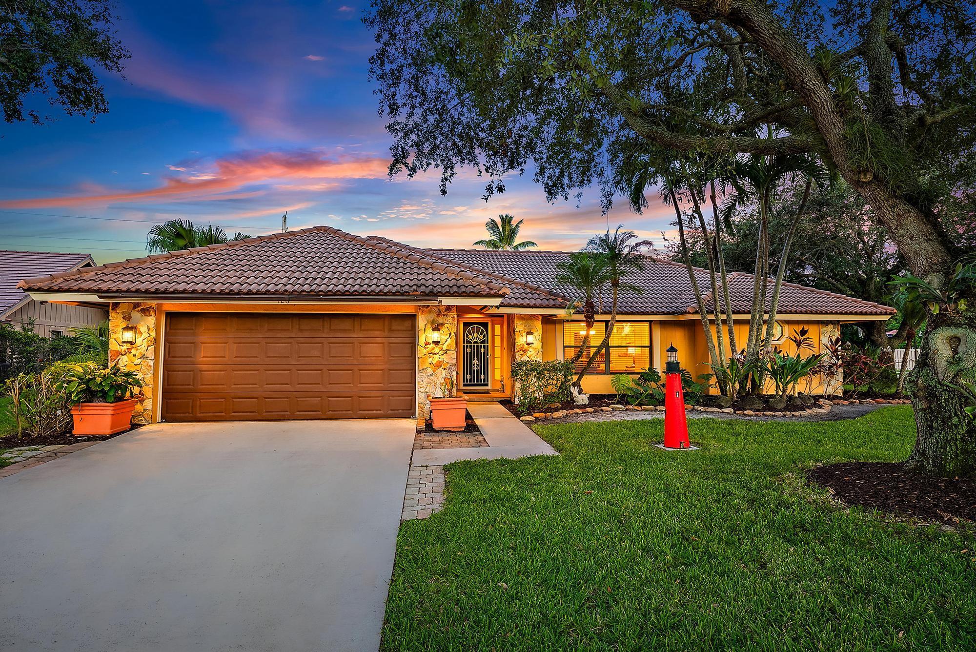 Welcome to your dream home in the heart of Jupiter, ideally situated on a spacious and beautifully landscaped .38-acre corner lot--offering ample space to park your boat, RV, or additional vehicles with ease.This charming single-story residence boasts 3 bedrooms and 2 bathrooms across 1,668 square feet of thoughtfully designed living space. Step inside and you'll immediately be welcomed by a bright, airy atmosphere, enhanced by four sets of sliding glass doors that flood the home with natural light and open seamlessly to your private covered lanai--the perfect blend of indoor-outdoor living.The kitchen is well-equipped with newer appliances, making meal prep and entertaining a delight, while the updated guest bathroom adds a fresh, modern touch.