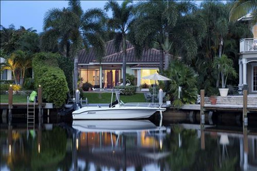 A short one-block stroll from the ocean in the desirable North Beach neighborhood, this fully renovated, architecturally designed residence enjoys a lush tropical oasis on a scenic waterway with 30+/--ft. dock. For relaxed Florida living, glass doors join the easy open layout to the screened loggia, sparkling pool and water view. Beautiful Brazilian cherry floors and airy tray ceilings are featured.  See Supplement.