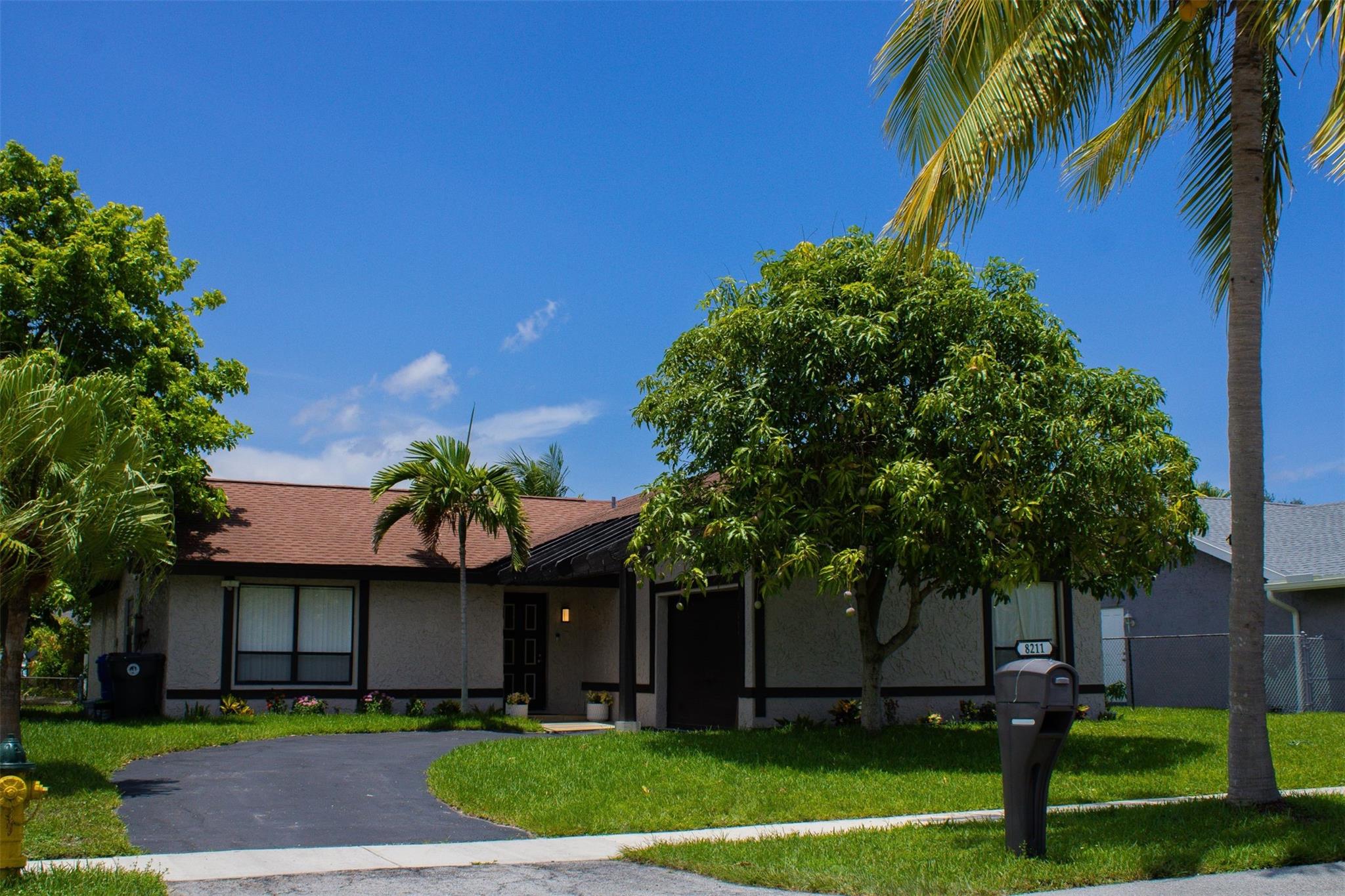 Beautiful well kept home vaulted ceilings no hoa fenced in spacious backyard. fruit trees mangos, coconuts and ackee. Room for a pool tankless water heater. roof 2018 ac 2019 Centrally located. Ready to move in and easy to show. Come make this beautiful home yours. It wont last!
