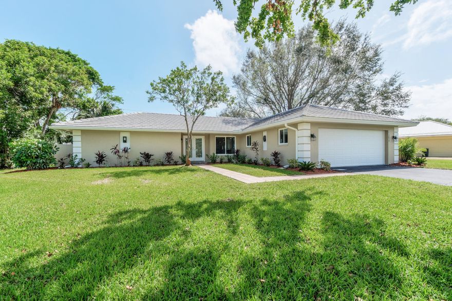 FULLY RENOVATED 3BD/2.5BATH CBS home in highly desired Yacht & Country Club of Stuart. This spacious, beautifully designed 2262 sq ft home is stunning and perfect for entertaining large groups or intimate gatherings by the fireplace.  Exterior renovations include a NEW CONCRETE TILE ROOF, HURRICANE IMPACT WINDOWS & DOORS, NEW A/C, landscaping, and exterior paint.  Interior includes an open kitchen with new soft close cabinets and drawers,  new quartz countertops, and all new stainless steel appliances.  New Luxury flooring throughout and newly tiled spa like bathrooms. All renovations were completed in 2017. Additional features include an oversized 2 car garage with a side golf cart garage door.  Low HOA, golf, tennis, pool, dining...Club membership avail but not required.  Info in Doc