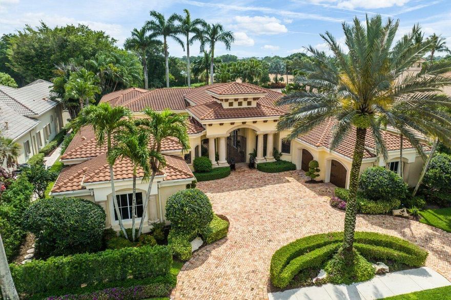 Spectacular Estate Home in desirable Ballenisles Golf Club in the exclusive enclave of Grand Pointe! This one of a kind home boasts 5 bedrooms, 6.2 baths, 3.5 car garage, office/den, including a sought after guest home and so much more. As you walk through the custom gates you will be enamored by the beauty of your private spacious courtyard with soothing sounds of the fountain. Once you enter the spacious foyer you will be amazed by the architectural detail and custom finishes throughout this stunning property. The custom wine closet is the perfect addition to the luxurious dining room. Relax in the expansive Primary Suite where you are surrounded by stunning views of your backyard oasis. The space also offers a grand sitting area, his/her fitted closets, and unique architectural detailing. The backyard is an entertainers dream with golf course views, custom heated pool & spa, tranquil water features, and lush landscaped gardens. Other features include newer roof, wet bar, built in grill, Armor screen protection, and much more! Call for your private tour today!