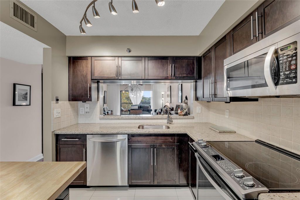 Photo of 2206 S Cypress Bend Drive #307, Pompano Beach, FL 33069 (MLS # F10418619)