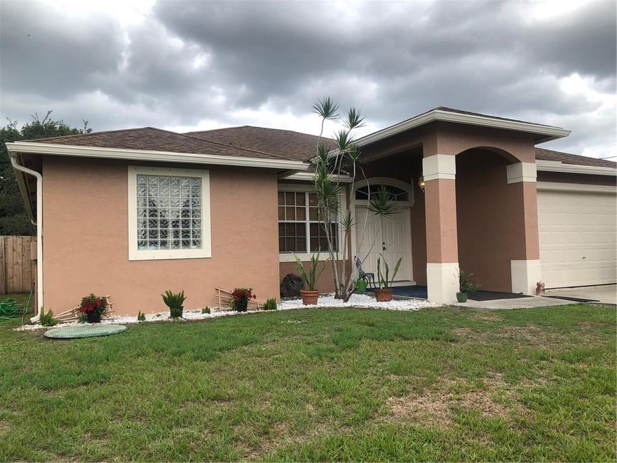 This fabulous house in the heart of Port St. Lucie is move in ready. Open and airy floorplan that includes Living Room, Dining, Kitchen and family room that has triple sliders leading out to the tropical backyard which is completely fenced in. The main suite also has a gorgeous view of the tropical backyard. There is a huge bath with everything you could ask for. Plus a huge walk in closet. The other 2 bedrooms are split plan. The A/C has been replaced. Everything you're looking for. Take a look! You won't be disappointed.