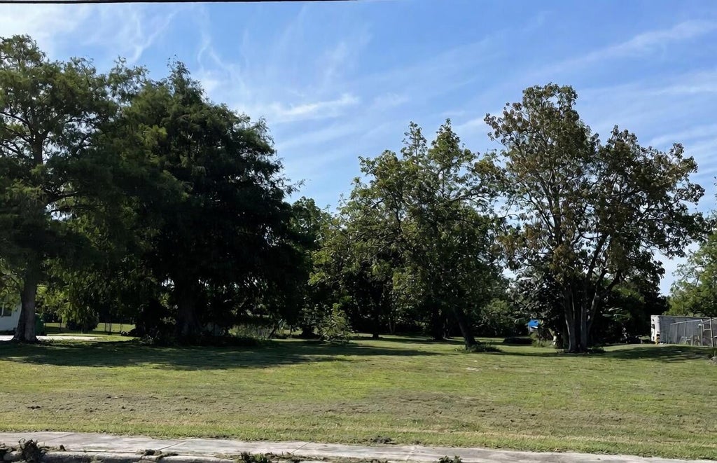 Photo of 1697 Bacom Point Road, Pahokee, FL 33476 (MLS # B26015008)