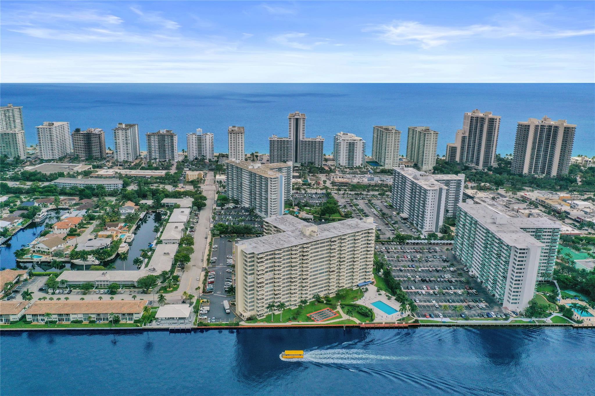 Welcome to Coral Ridge Towers North, a landmark community positioned between the Intracoastal and the ocean. This 1,120 sq. ft. corner residence offers impact windows and doors, spacious living areas, two bedrooms, two baths, and abundant closet space. Ready for your personal touch, it enjoys a pleasant third-floor setting with a peek of the Intracoastal. Enjoy resort-style living on 5 acres with a heated waterfront pool, fitness center, community room, shuffleboard, library, BBQ area, car wash, bike storage, boat dock, EV charging, and 24/7 security. The building features a beautifully updated lobby, recent major upgrades, and an active social calendar. Fantastic location—just seconds to the beach, shops, cafes, and restaurants. 55+ Building, no pets, no leasing, 50% financing allowed.
