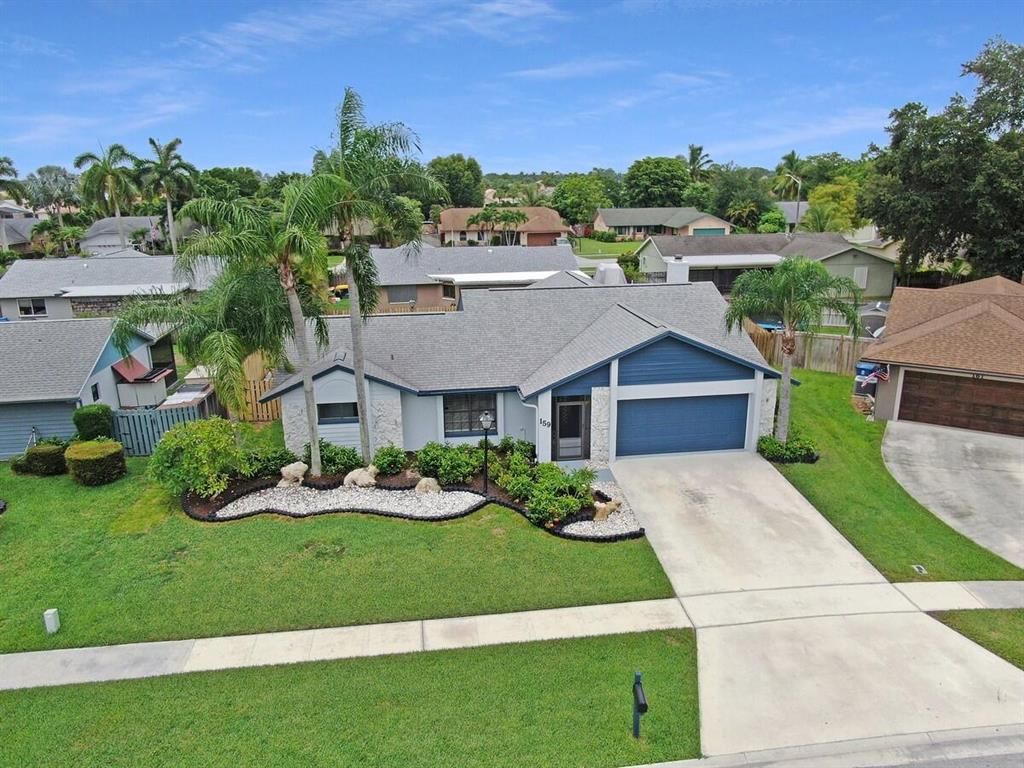 Photo of 159 Parkwood Drive, Royal Palm Beach, FL 33411 (MLS # R10729629)