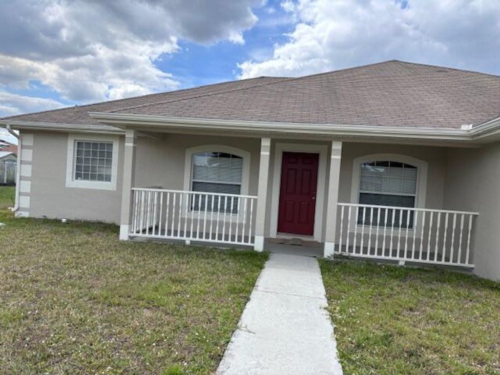 Photo of 3072 SW Circle Street, Port Saint Lucie, FL 34953 (MLS # R10973867)
