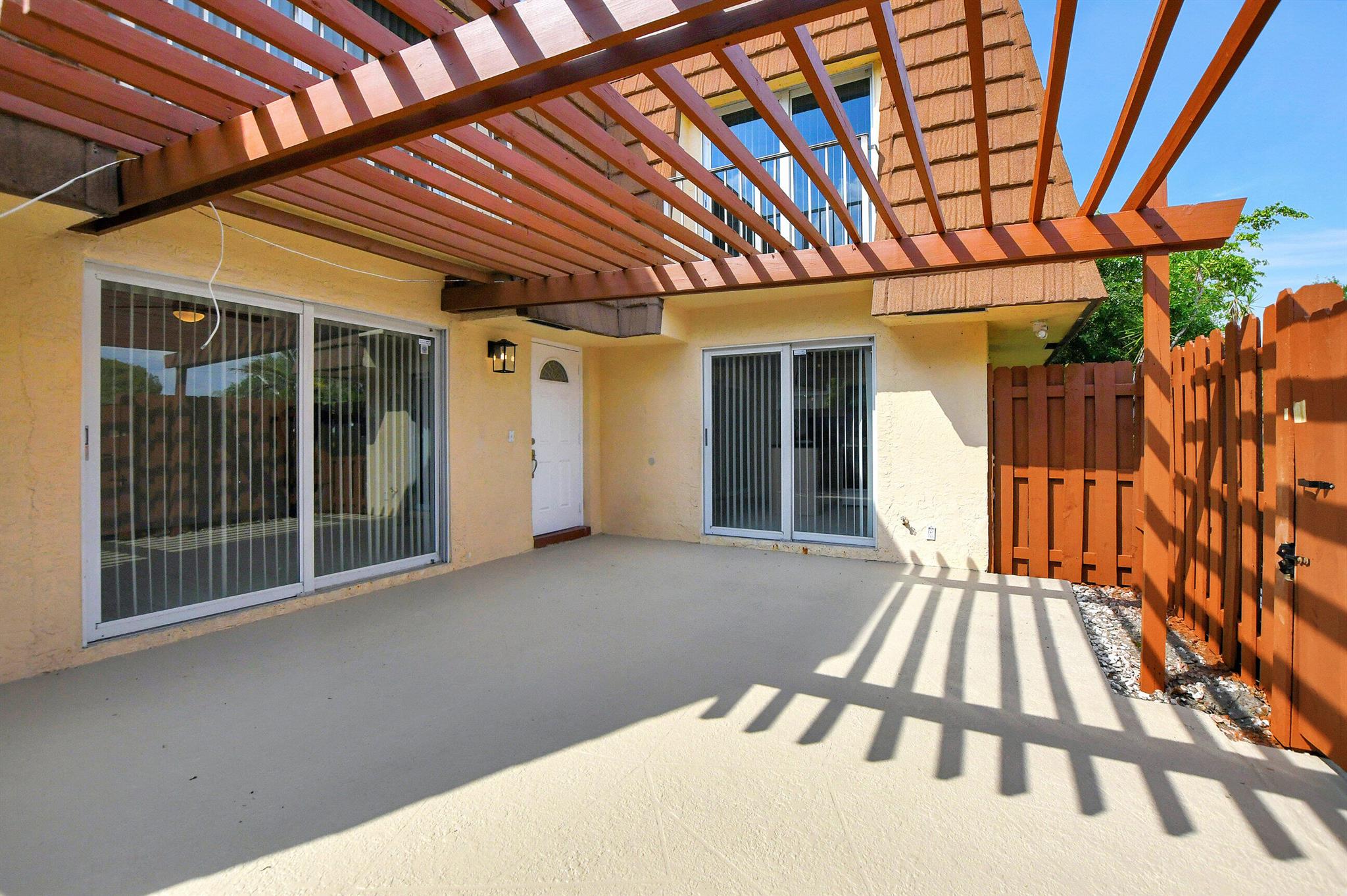 This townhouse is clean and ready for occupancy. All bedrooms with vinyl flooring, Tile on first floor and new carpeting on stairs. newer kitchen, washer and dryer in unit, impact windows and sliders, updated bathrooms. Beautiful large courtyard with new fencing enclosure. and 2 parking spaces. This is a prime location. Close to I-95, the beach and downtown Atlantic Avenue shops and restaurants.