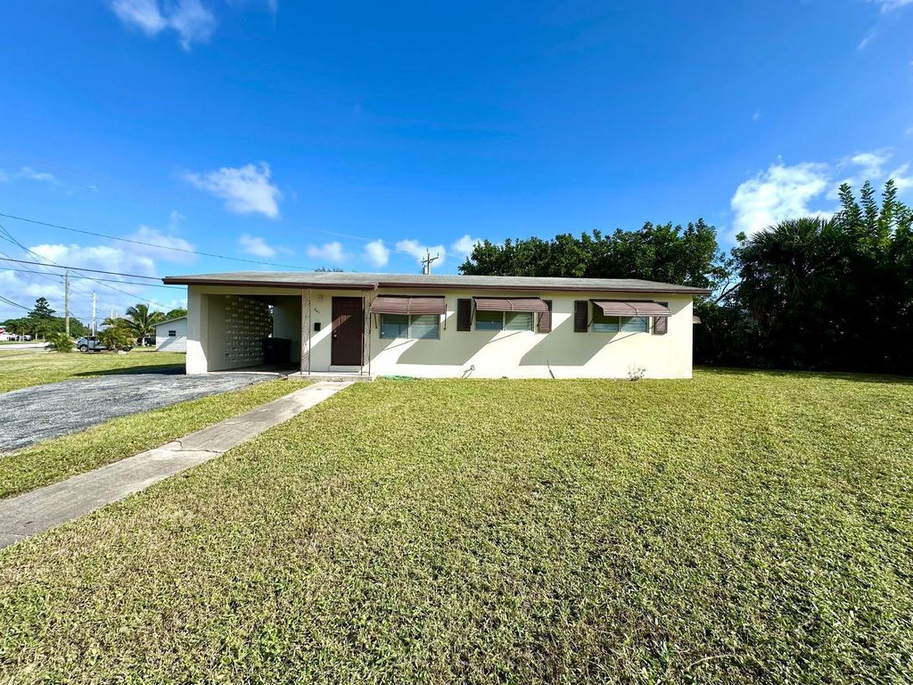 Photo of 861 W Ilex Drive, West Palm Beach, FL 33403 (MLS # R11136161)