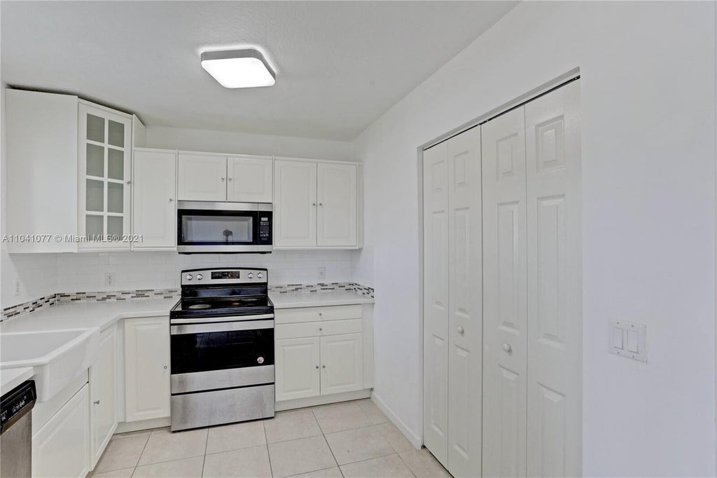 Photo of 3810 N JOG Road #106, West Palm Beach, FL 33411 (MLS # B26080435)