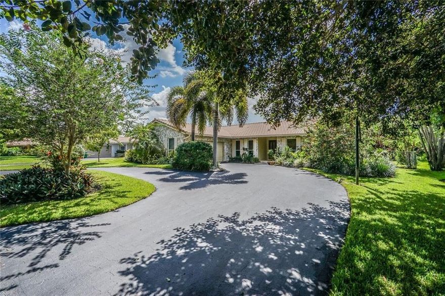 Updated, spacious 4 bedroom/2 bath - pool home. Large foyer entry, formal dining and living with beautiful wood floors and vaulted ceilings, custom kitchen w/tall maple cabinets, pull outs, wine rack, lots of over sized drawers, extra deep pantry, granite counters, stainless appliances, bar seating, breakfast area open to the large family room.  sliders all along back side, light, bright and overlooks relaxing, private pool area.  Updated bathrooms, impact windows (all but one), new pool finish.
