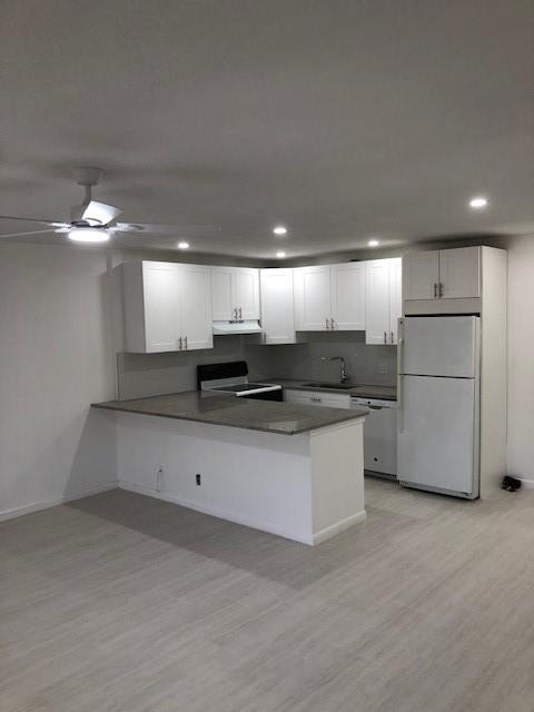TOTALLY NEWLY RENOVATED WITH SOME HIGH-END FEATURES LIKE STONE COUNTERS AND NEUTRAL TILE THROUGHOUT PLUS D/W AND LARGE PENININSUAL TO ACCOMMODATE 4 BAR STOOLS !!!!! Clubhouse has1,600-seat theater, 800-person ballroom, indoor/outdoor cafe, pickleball courts, full fitness center, 9 tennis courts, indoor & outdoor pools, , walking trails.........close to shopping and beach. $75 Processing Fee to Century 21 Tenace, can pull credit/background for 1 person or couple.