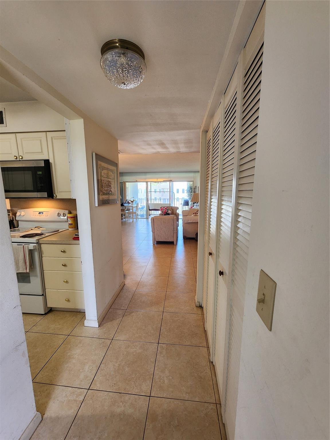 Nicely located top floor unit with 2 spacious bedrooms, each with walk in closets, 2 spacious baths, master has a walk in shower and guest bath has a tub. Third room is our TV room but can be changed to bedroom. Ceramic tile floors through out, except in master bathroom, where the wooden floor was installed 2 years ago. New stove and microwave bought a few months ago. Most of the furniture stays, depending of the Buyer preferences. Washer and Dryer next to the kitchen, in an utility closet. Amazing cable system, with possibility to stop and go 2 days back on most of our channels and INTERNET is included. Great pool and picnic area just a 3 minutes walking distance. Close to Fla's Turnpike, Restaurants, Shopping, PBI Airport, and Beaches. Enjoy the lifestyle in this prestigious community.