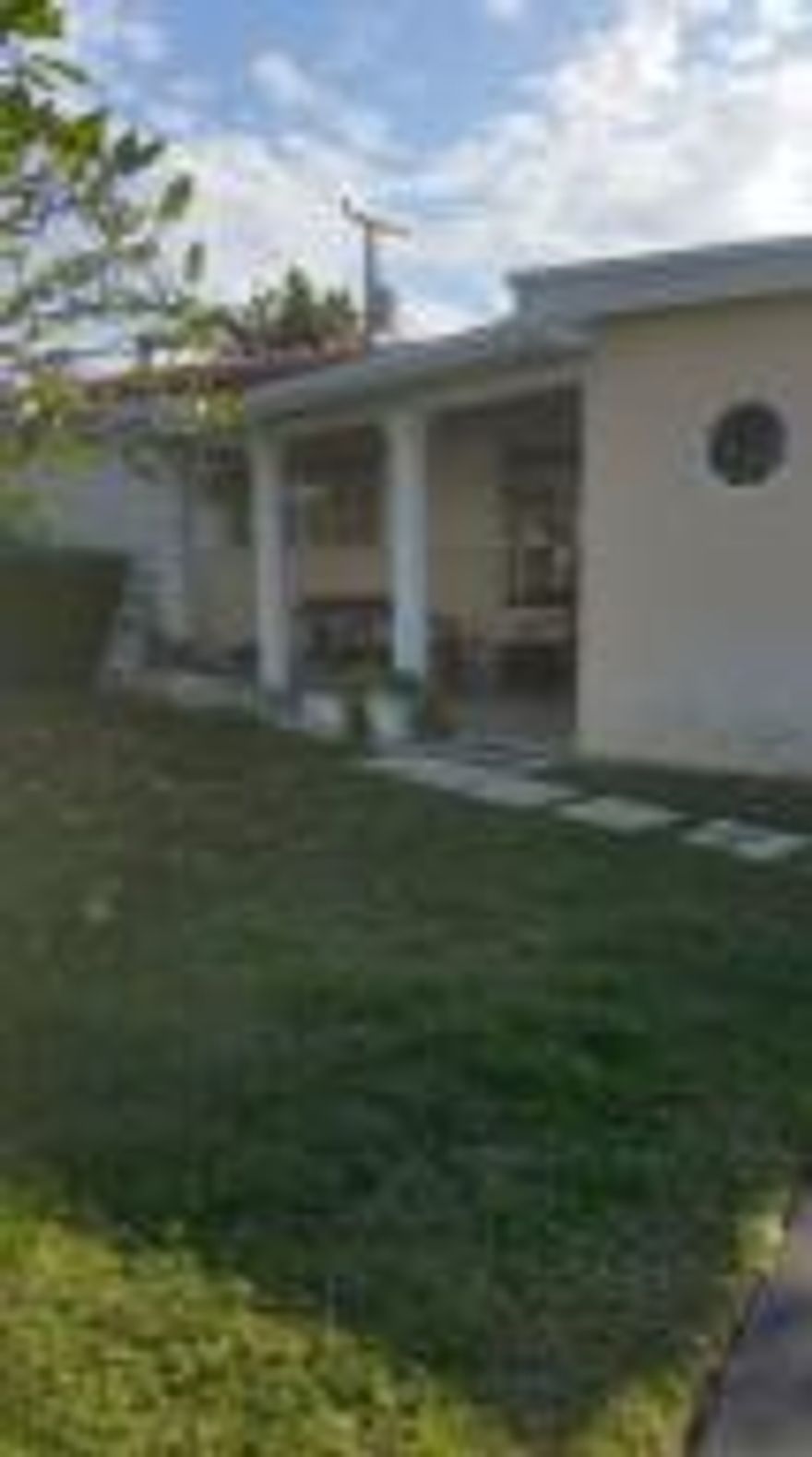 Located in much desired east Boca Raton. Make this home your own. The many upgrades include remodeled kitchen with new dark cabinetry and granite countertops, stainless steel appliances.
Wonderful ''bonus room'' connected to master bedroom with endless possibilities for an office, exercise room or nursery. It has a huge wall of closets as well. All three bedrooms have dark wood laminate flooring with large neutral tiles throughout the rest of the home. The bathrooms have been updated with new tile and vanities. The porch has been enclosed making for additional living space.
The exterior is waiting for your personal touch with regard to paint and landscaping. Make this diamond in the rough your own.