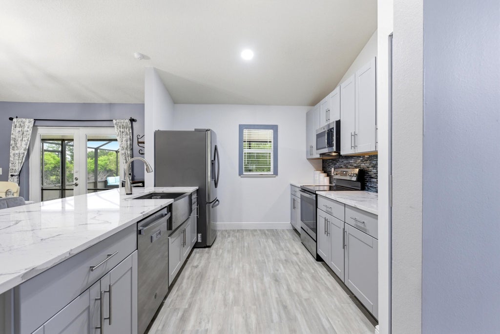 Photo of 105 SW Glenwood Drive, Port Saint Lucie, FL 34984 (MLS # B26039826)