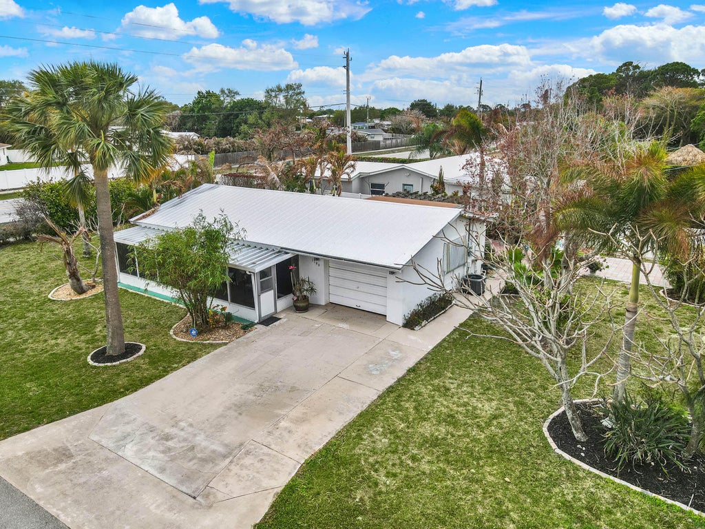 Photo of 1180 NE Crescent Street, Jensen Beach, FL 34957 (MLS # B26001214)