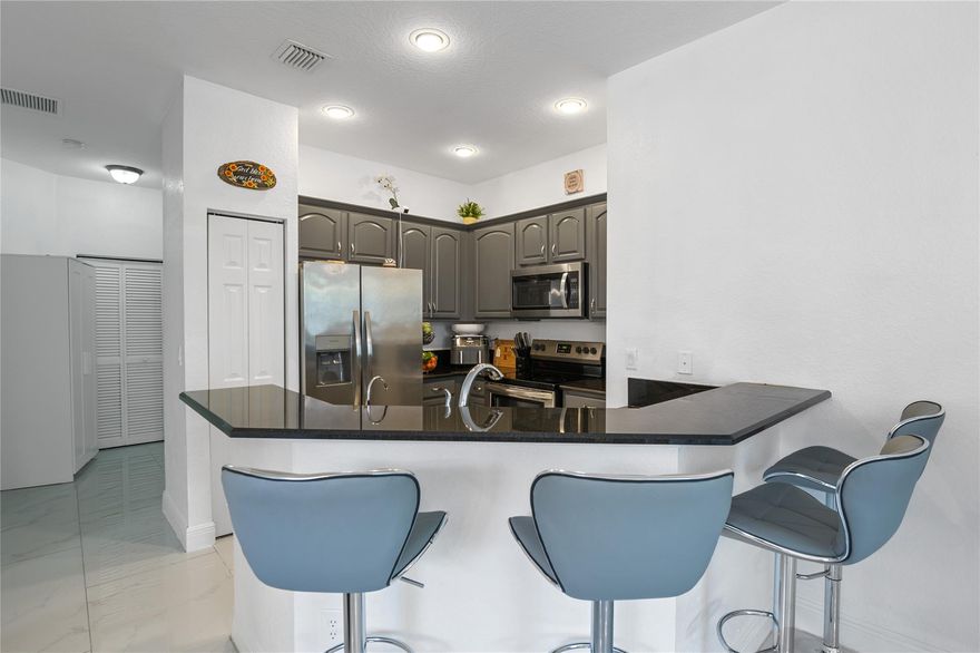 JUST REDUCED. Corner unit, 3-bedroom, 2-bathroom condo offers modern living with an open kitchen concept that blends with the living and dinning areas creating a fluid and inviting space. New washer, new stove, new master closet, new title floor. Situated in the desirable Hampton Hills gated community with fast access to Sawgrass expressway, Turnpike and 595.