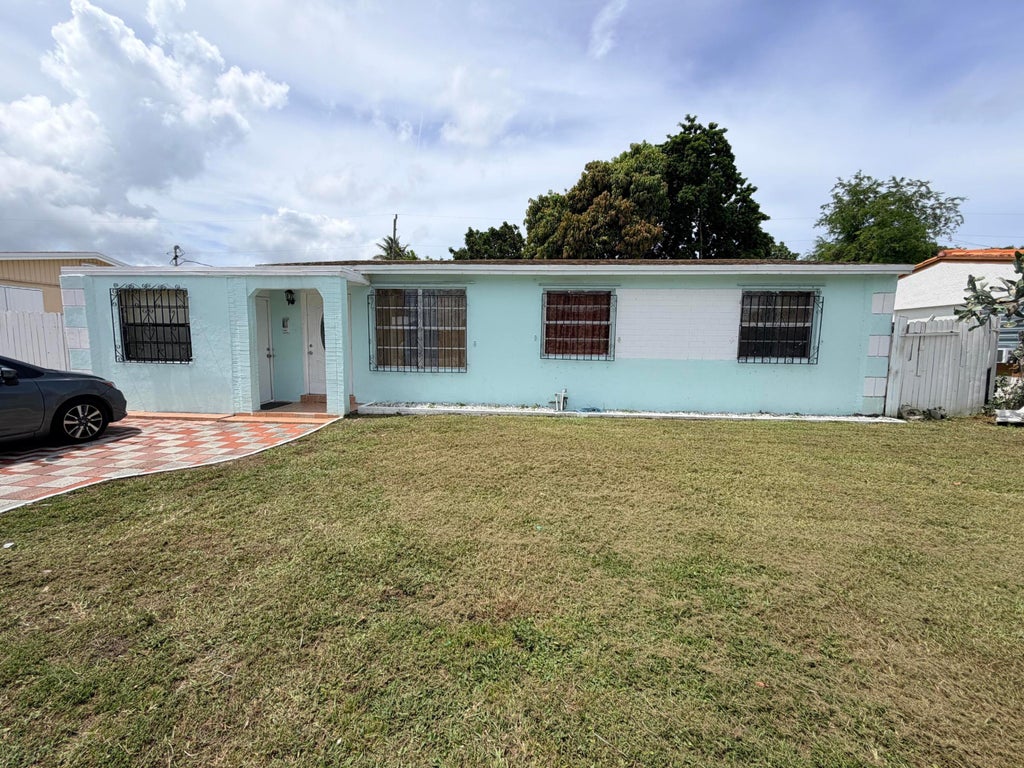 Photo of 2033 Longwood Road, West Palm Beach, FL 33409 (MLS # B26050580)