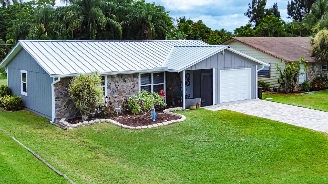 Fall in love with this move-in ready gem in Stuart's desirable Hibiscus Park, where modern updates meet Florida charm. Imagine cooking in your stylish 2020 remodeled kitchen, relaxing in the cool comfort of your brand-new 2024 HVAC, and enjoying peace of mind with 2020 impact windows, 2023 patio door accordion shutters, and a 2022 standing seam metal roof. The 2022 driveway adds curb appeal, while the 2019 city water/sewer conversion offers everyday convenience. Just minutes from downtown, beaches, shopping, and dining--this home is your perfect launchpad for the coastal lifestyle you've been dreaming of.