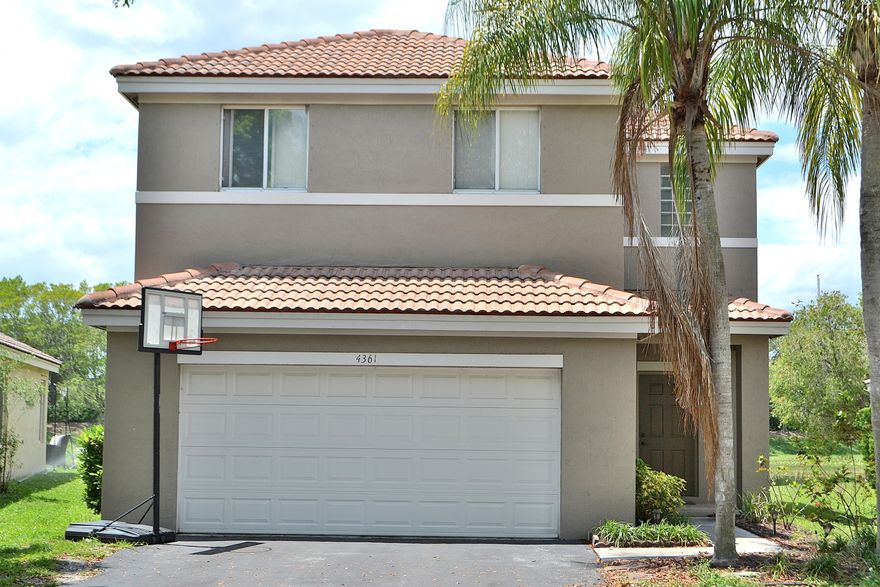 Excellent value on this beautifully situated 4-bedroom, 2.5-bath waterfront home in the sought after gated community of The Ridges. This two-story residence offers a newer roof, updated A/C system, and tile flooring throughout first floor and LVP on second floor. Designed for both everyday living and entertaining, the home includes a spacious two-car garage and inviting interior spaces filled with natural light. Step outside to enjoy tranquil lake views from your backyard—perfect for relaxing or hosting. Located in Weston, a highly sought-after area known for its top-rated schools and exceptional quality of life.