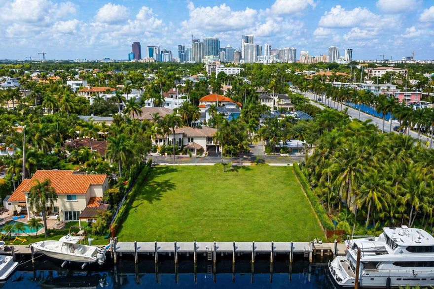 Rare opportunity on the south side of Las Olas Isles with 100 feet of deepwater frontage and no fixed bridges, offering faster ocean access for serious boaters. Positioned on an exceptional waterfront lot with a brand new concrete dock, the property is offered with plans already submitted to the city, potentially saving a buyer significant time and carrying costs in the development process. Surrounded by some of Fort Lauderdale's most prestigious waterfront estates, 310 Coral Way combines premier positioning, redevelopment potential, and long term value in one of the most desirable locations within Las Olas Isles.