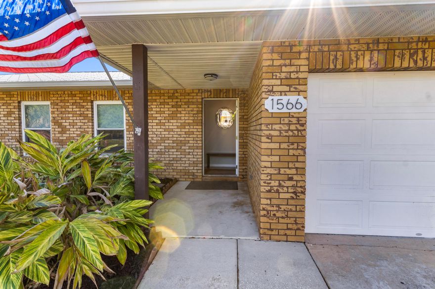 Tucked on an oversized lot, this 2BR/2BA home is a true gardener's paradise—lush, private, and full of charm. Major updates offer peace of mind, including full re-plumbing from the street, a newer metal roof, impact windows, updated A/C, and water heater. Inside, you'll find a well-maintained interior with both bathrooms beautifully renovated. The one-car garage is fully under air, adding flexible space for a gym, office, or hobby room. A rare blend of function, comfort, and outdoor serenity—this one stands out!