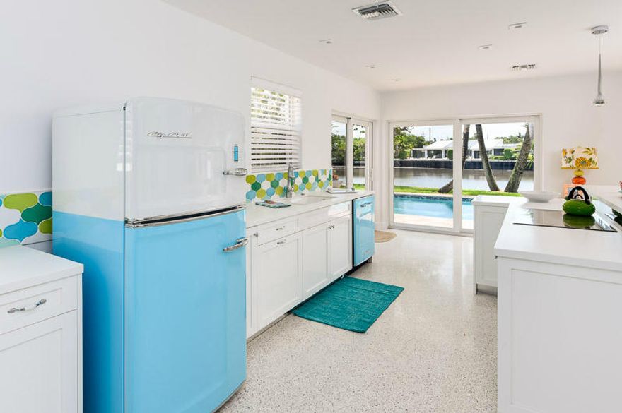 Fun and modern this 3 bedroom, 2 bath waterfront residence is sited on 100 feet of water frontage on the Intracoastal Waterway with serene water views from all of the living areas.  Located in the Palm Beach community of Ibis Isle, this residence is a hidden waterfront gem.  The residence boasts, all new Kitchen Appliances, New Bathrooms, New Impact Windows, and the Pool has been resurfaced.  An attached two car garage offers extra space for beach toys, kayaks and surfboards.   Glass doors open to the beautiful pool and patio for easy entertaining.  Steps away from this chic property is The Four Seasons Resort, The Raymond Floyd Par 3 Golf Course, Tideline Resort and Spa, Bike path and Ocean Beaches. Published in the Shiny Sheet for its "Retro Attitude".