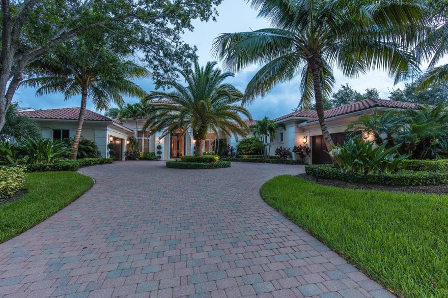 Exquisite custom home with panoramic golf and lake views. No detail untouched. One story 3BR + office & theater, 3.1BA, 4 car garage.  Built in 2010 and masterfully detailed by discerning owners. Stone floors w/inlays, granite, volume ceilings w/molding & indirect lighting, extensive niche & ceiling details, applied wall moldings. Formal living w/gas fireplace, formal dining, theater insulated for sound has brand new 4K movie system and 100'' screen, custom paneled library w/wood floor & built-in cabinetry, gourmet kitchen w/ Wolf appliances, under-cabinet lighting, & butler's pantry with wine cooler, family room w/ soaring windows and custom entertainment center. Light touch system, impact glass,  bath retreat w/frameless glass shower, whirlpool tub, double vanity, bidet,