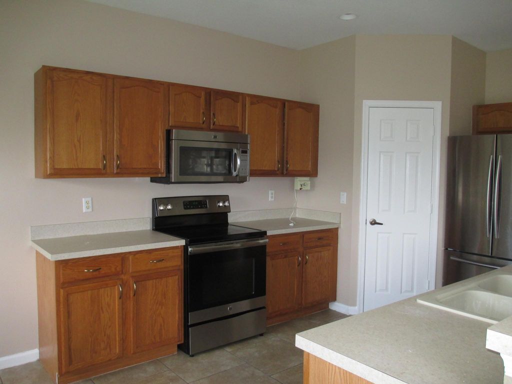 Photo of 3656 SW Ballweg Street, Port Saint Lucie, FL 34953 (MLS # R10970997)