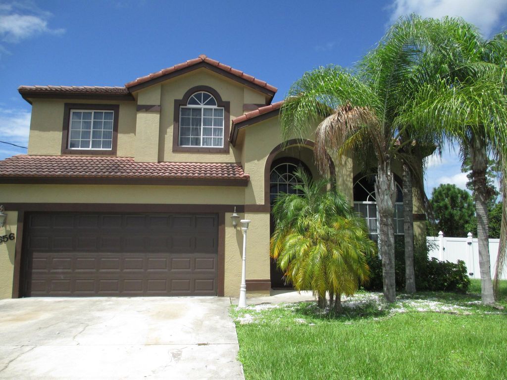 Photo of 3656 SW Ballweg Street, Port Saint Lucie, FL 34953 (MLS # R10970997)