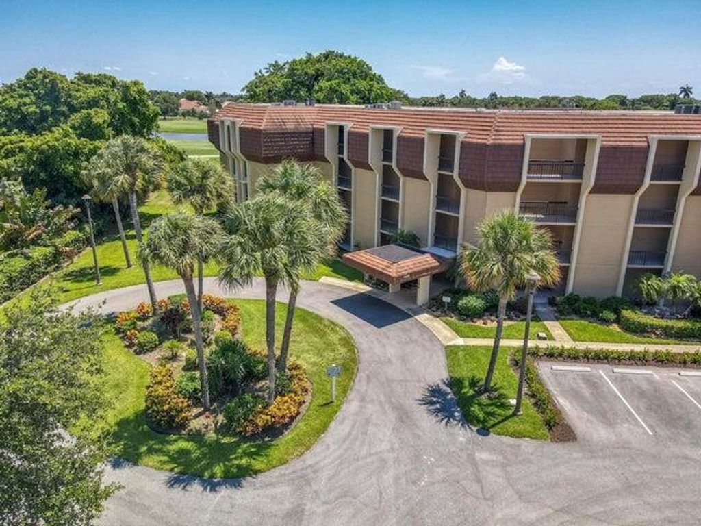 Photo of 5350 Woodland Lakes Drive #209, Palm Beach Gardens, FL 33418 (MLS # R11109017)
