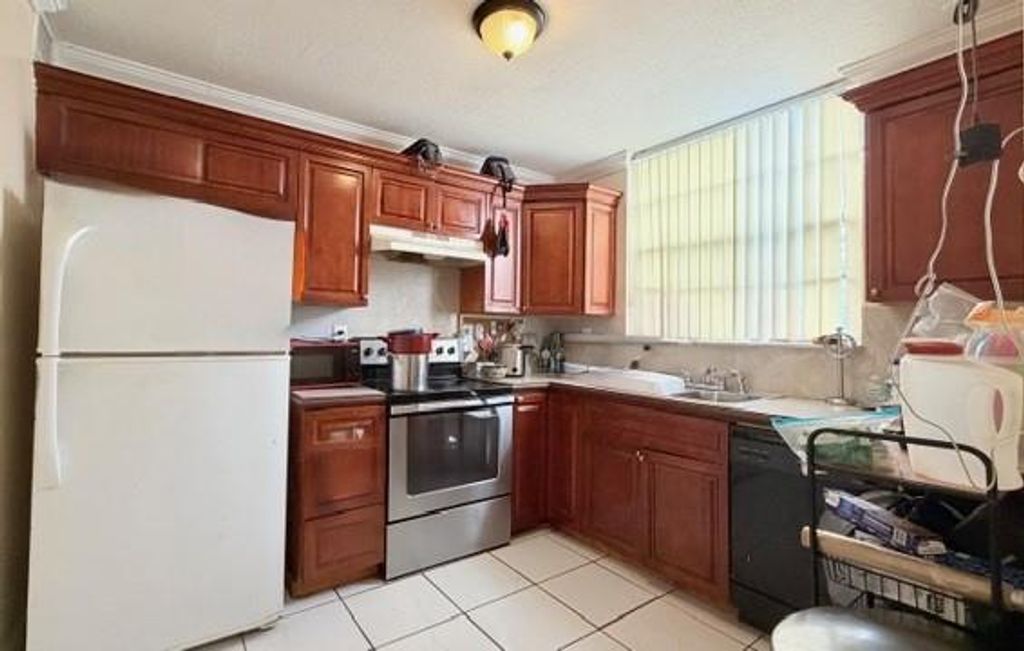Photo of 1794 NW 55th Ave #203, Lauderhill, FL 33313 (MLS # F10531966)