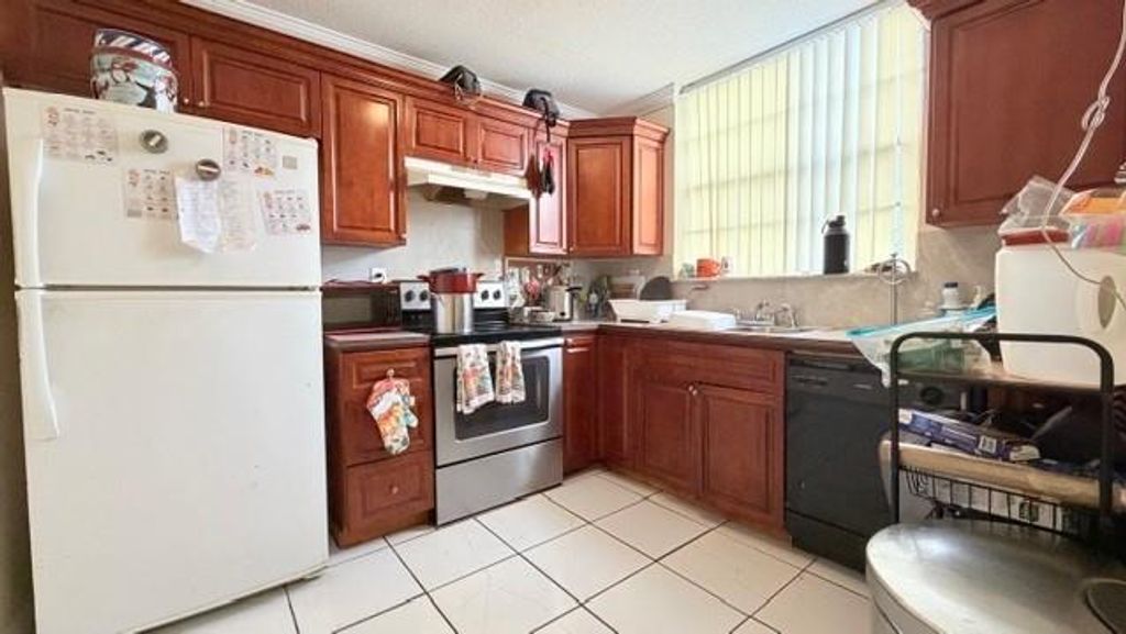 Photo of 1794 NW 55th Ave #203, Lauderhill, FL 33313 (MLS # F10531966)