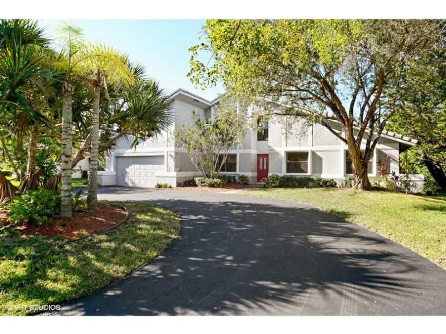 Beautiful custom 4 br 2.5 bath home plus loft.Kitchen has been totally renovated with wood, granite counters, and SS appliances. Micro is a GE Advantium.. like a second oven.The home is hurricane protected with a combo of impact windows and doors and acco rdion hurricane shutters.  All baths have been renovated. Large private outdoor area with bricked paved screened in patio and open pool with mango trees. Crown molding in living areas, huge laundry room with new washer/dryer. Roof replaced in 2006.