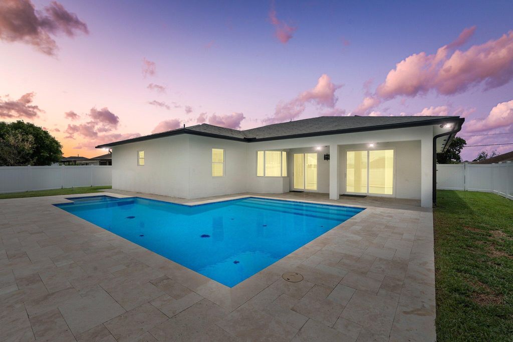 Photo of 979 SW McDevitt Avenue, Port Saint Lucie, FL 34953 (MLS # R11096874)