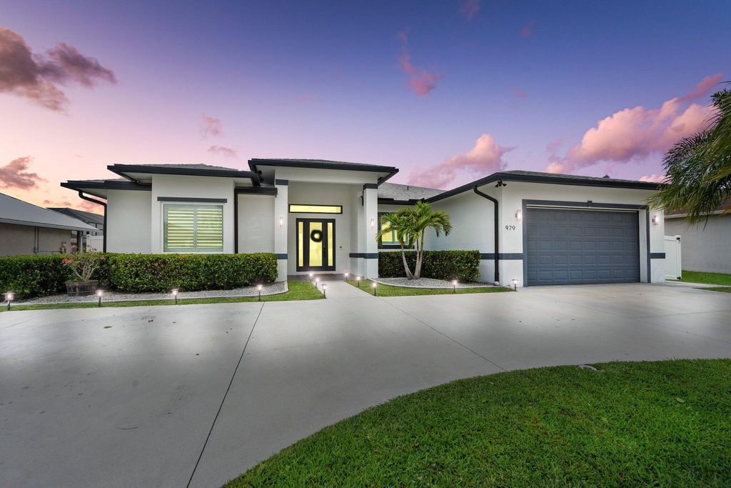 Photo of 979 SW McDevitt Avenue, Port Saint Lucie, FL 34953 (MLS # R11096874)