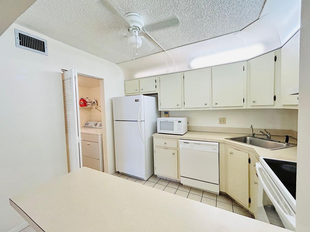 Photo of 414 Pine Glen Lane #C-1, Greenacres, FL 33463 (MLS # R11148034)