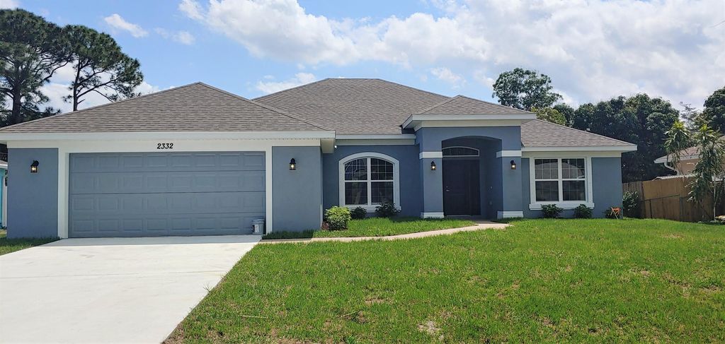 Photo of 2332 SE Fruit Avenue, Port Saint Lucie, FL 34952 (MLS # R10790385)