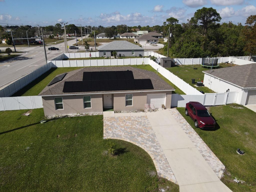 Photo of 402 NE Mainsail Street, Port Saint Lucie, FL 34983 (MLS # B26047288)