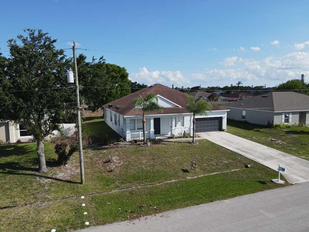 Photo of 948 SW Jeremko Avenue, Port Saint Lucie, FL 34953 (MLS # B26005949)