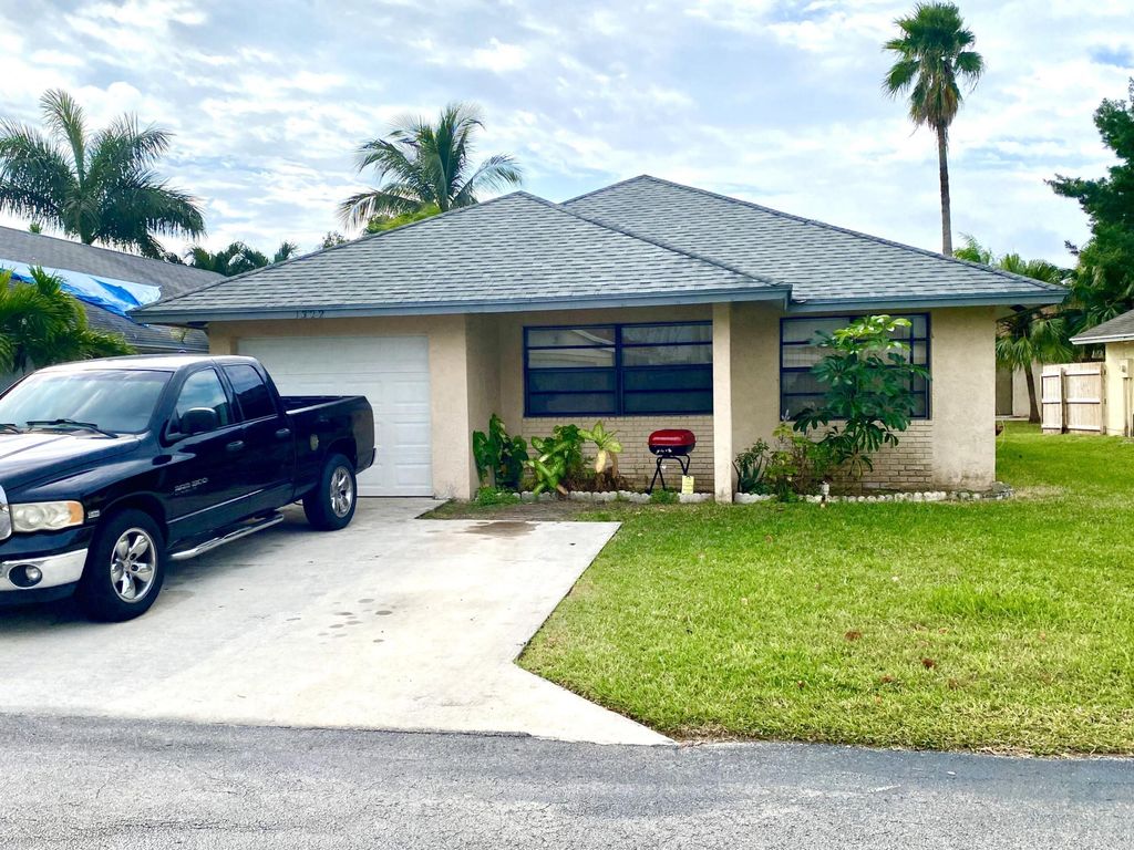 Photo of 1322 Pines Lane, West Palm Beach, FL 33415 (MLS # B26002935)